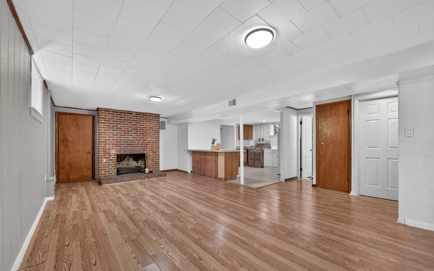 Lower level with brick fireplace